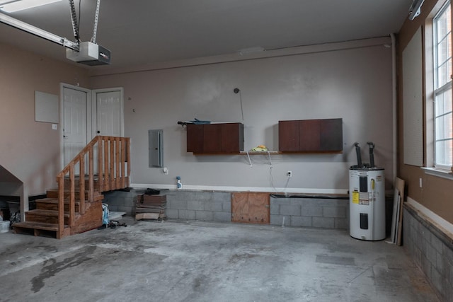101 Brookstone Dr, Burns, TN 37029 - garage with electric panel, a garage door opener, and electric water heater
