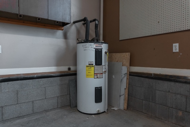 utility room featuring electric water heater