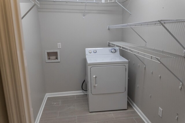 101 Brookstone Dr, Burns, TN 37029 - clothes washing area featuring washer / clothes dryer, laundry area, and baseboards