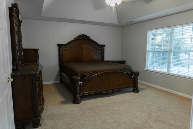 bedroom featuring light colored carpet and ceiling fan