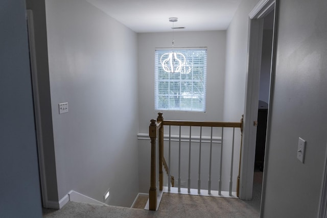 101 Brookstone Dr, Burns, TN 37029 - stairs with carpet floors, baseboards, and a notable chandelier