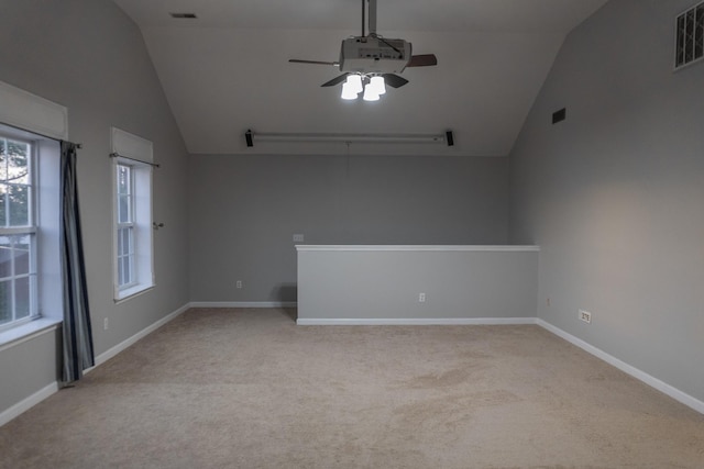 101 Brookstone Dr, Burns, TN 37029 - spare room with a healthy amount of sunlight, a ceiling fan, light colored carpet, and lofted ceiling