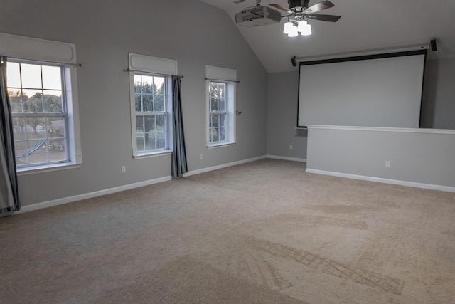101 Brookstone Dr, Burns, TN 37029 - carpeted empty room with ceiling fan, a barn door, baseboards, and high vaulted ceiling