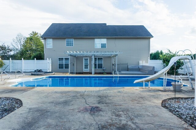 101 Brookstone Dr, Burns, TN 37029 - view of swimming pool with a fenced in pool, a water slide, a pergola, and fence