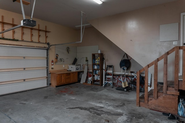 101 Brookstone Dr, Burns, TN 37029 - garage featuring a garage door opener