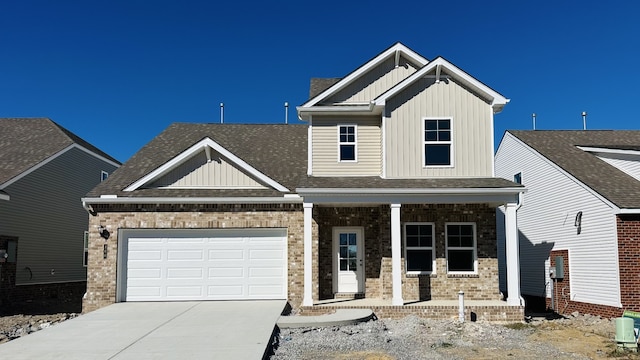 craftsman-style house featuring covered porch and a garage