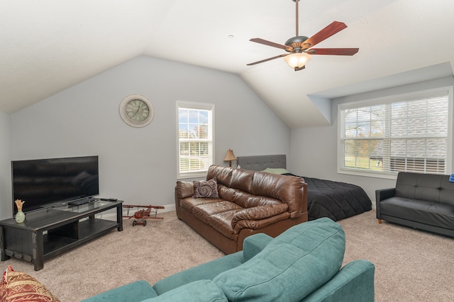 carpeted living room with vaulted ceiling and ceiling fan