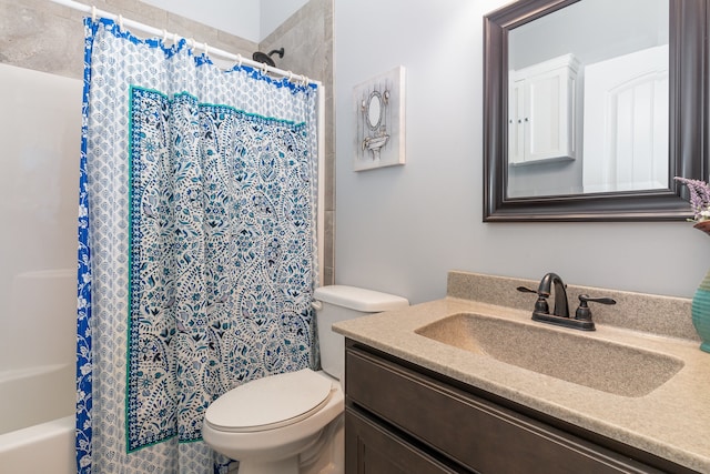 full bathroom with vanity, toilet, and shower / bath combo with shower curtain