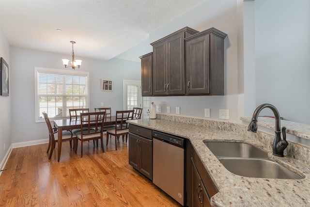 kitchen with light hardwood / wood-style flooring, dark brown cabinets, sink, and stainless steel dishwasher