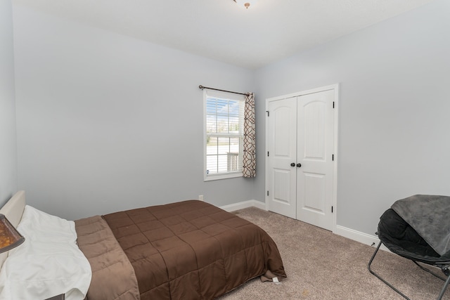 carpeted bedroom with a closet