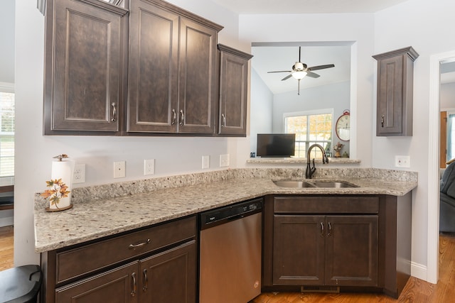 kitchen featuring sink, dishwasher, light wood-type flooring, dark brown cabinets, and lofted ceiling