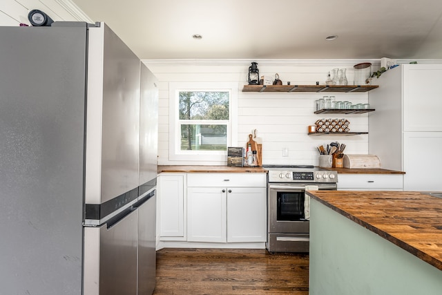 kitchen with white cabinets, wood counters, dark wood-type flooring, and appliances with stainless steel finishes