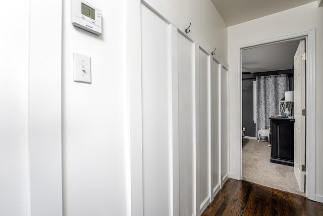 corridor with dark hardwood / wood-style floors