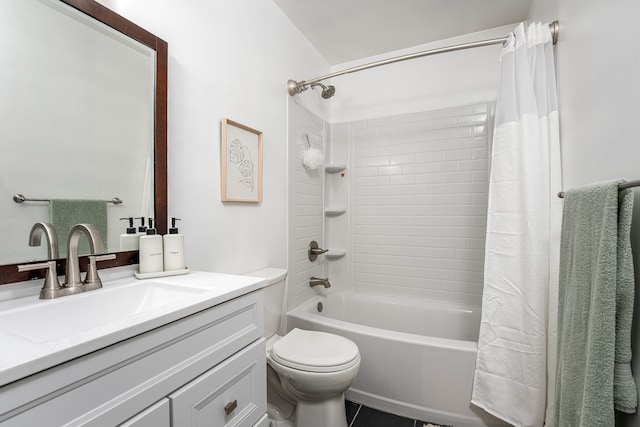 full bathroom featuring tile patterned floors, vanity, toilet, and shower / tub combo