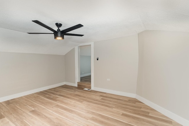 1828 S Main St, Columbia, TN 38401 - spare room featuring vaulted ceiling, ceiling fan, a textured ceiling, light wood finished floors, and baseboards