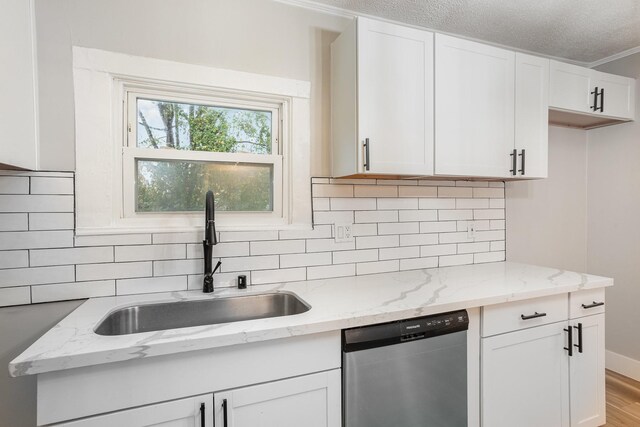 1828 S Main St, Columbia, TN 38401 - kitchen with dishwasher, a sink, backsplash, and white cabinets