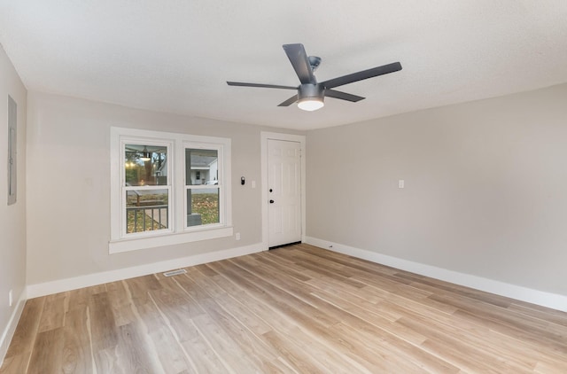 1828 S Main St, Columbia, TN 38401 - empty room with light wood finished floors, a ceiling fan, and baseboards