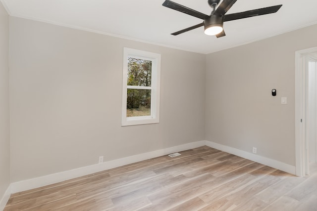 spare room with light hardwood / wood-style floors, crown molding, and ceiling fan