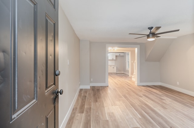 additional living space with a textured ceiling, light hardwood / wood-style floors, and ceiling fan