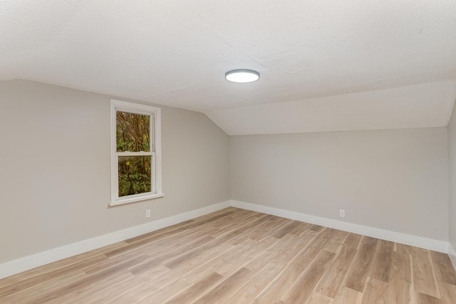 1828 S Main St, Columbia, TN 38401 - additional living space featuring vaulted ceiling, light wood finished floors, baseboards, and a textured ceiling