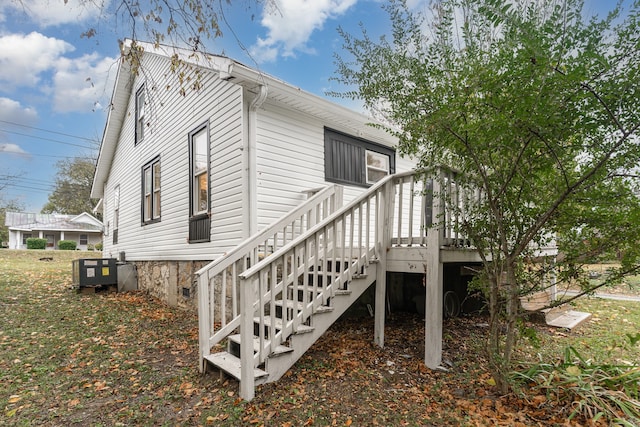 view of side of property with a wooden deck