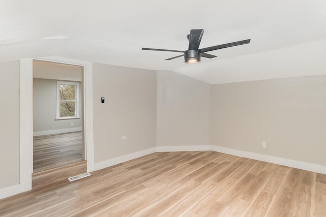 1828 S Main St, Columbia, TN 38401 - spare room featuring light wood-style flooring, ceiling fan, vaulted ceiling, and baseboards