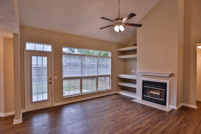 unfurnished living room with high vaulted ceiling, dark wood-type flooring, and ceiling fan