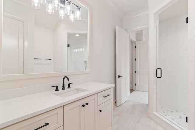 bathroom with vanity and a shower with door