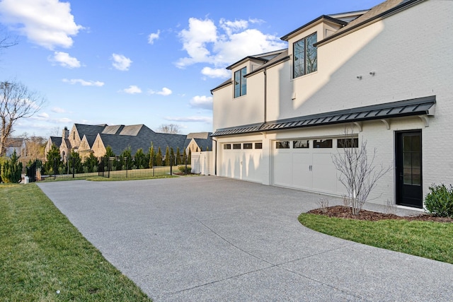 view of home's exterior featuring a yard and a garage