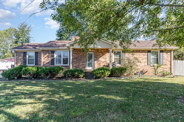 single story home featuring a front yard