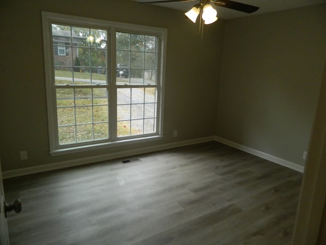 spare room featuring ceiling fan and hardwood / wood-style floors