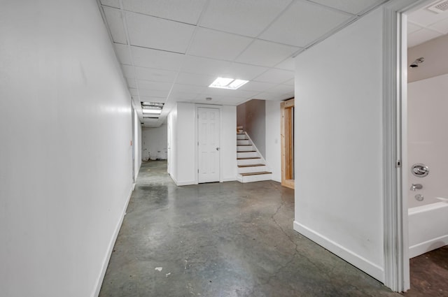 basement featuring a drop ceiling