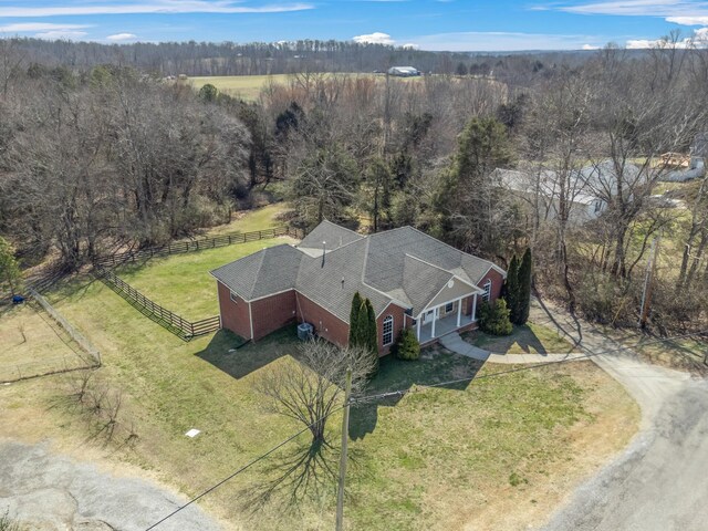 drone / aerial view with a rural view and a wooded view