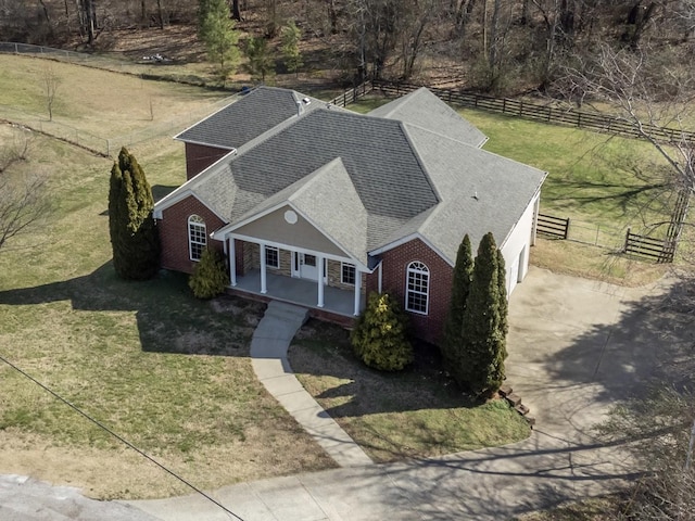 birds eye view of property with a rural view