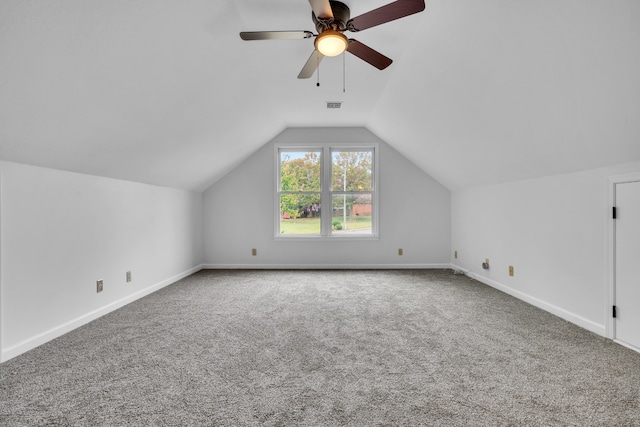 bonus room with ceiling fan, vaulted ceiling, and carpet floors