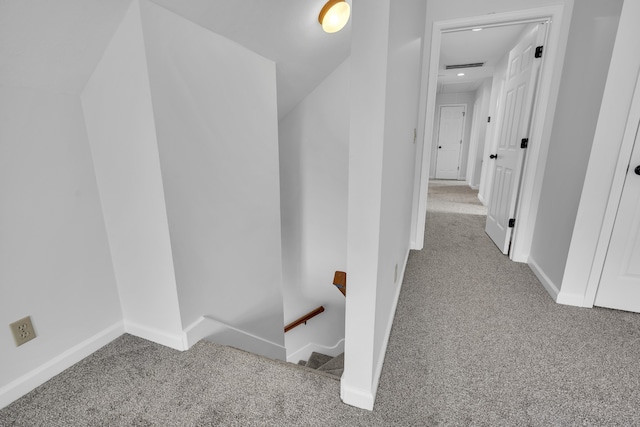 hallway with light colored carpet