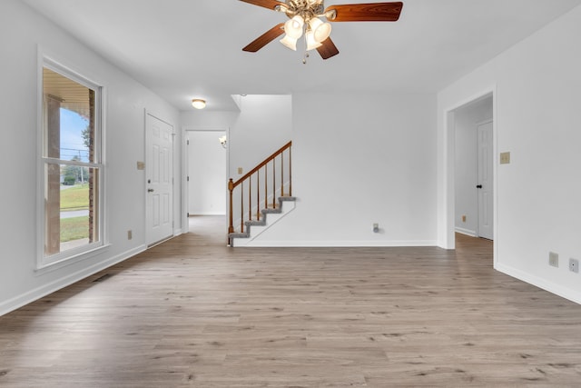 entrance foyer with light hardwood / wood-style floors and ceiling fan