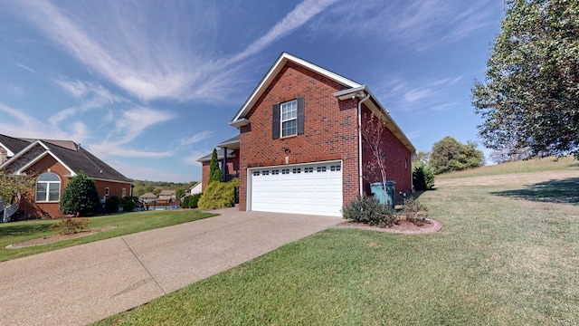 view of side of home featuring a yard and a garage