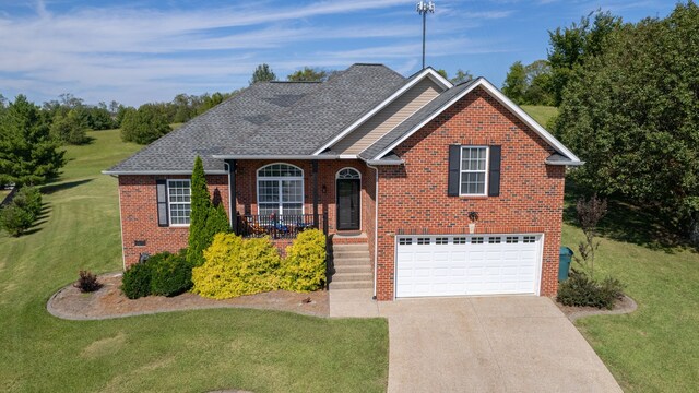 view of front facade featuring a front yard and a garage