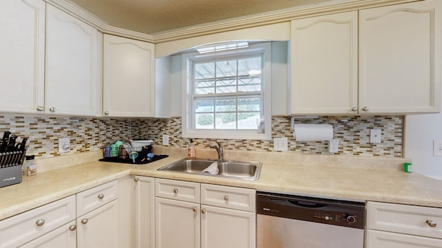 kitchen with tasteful backsplash, sink, a textured ceiling, stainless steel dishwasher, and white cabinets