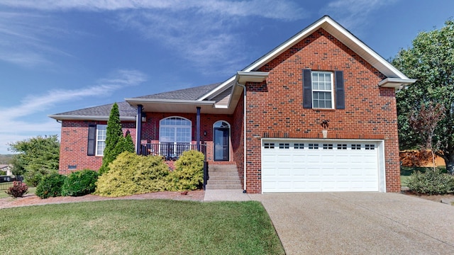 front facade featuring a front yard and a garage