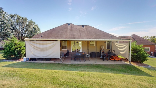 back of property featuring a patio area and a lawn