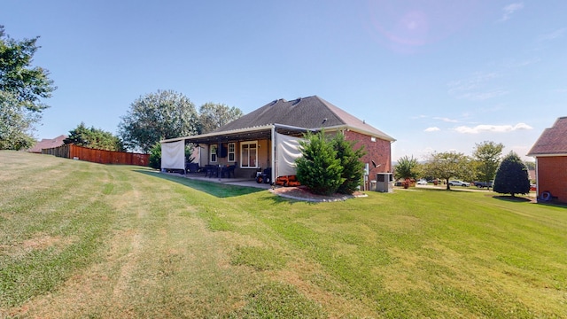 view of yard featuring a patio area and central AC unit