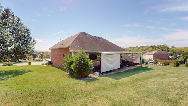 back of house featuring a lawn