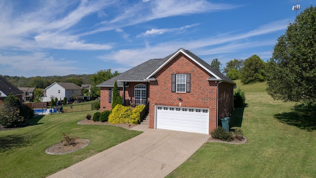 view of property with a front yard and a garage