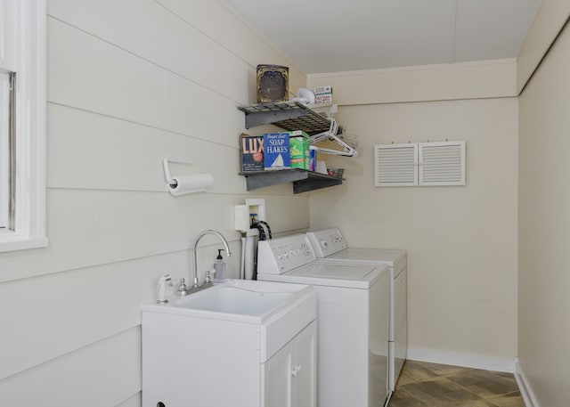 clothes washing area with separate washer and dryer