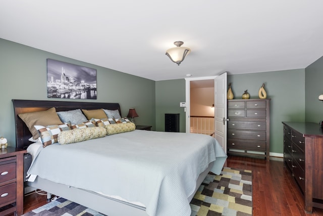 bedroom featuring dark hardwood / wood-style flooring