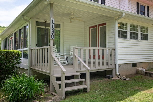 wooden terrace with covered porch and ceiling fan