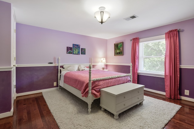 bedroom featuring dark hardwood / wood-style flooring