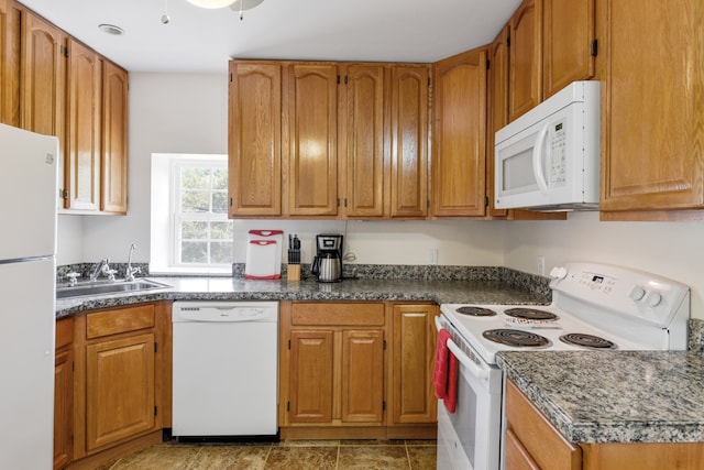 kitchen featuring sink and white appliances